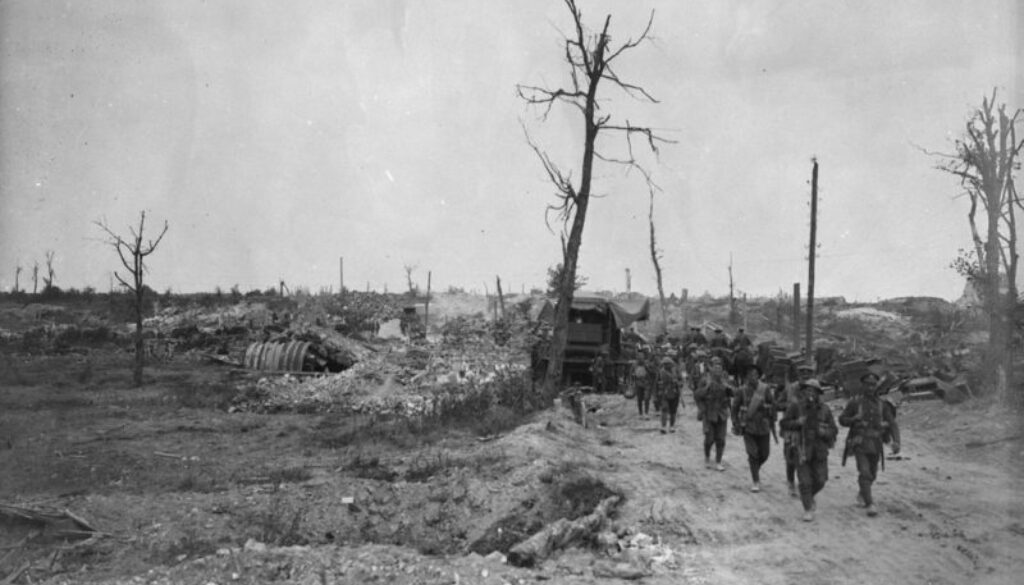 98_Canadian Infantry passing through captured village. Advance East of Arras. September, 1918.